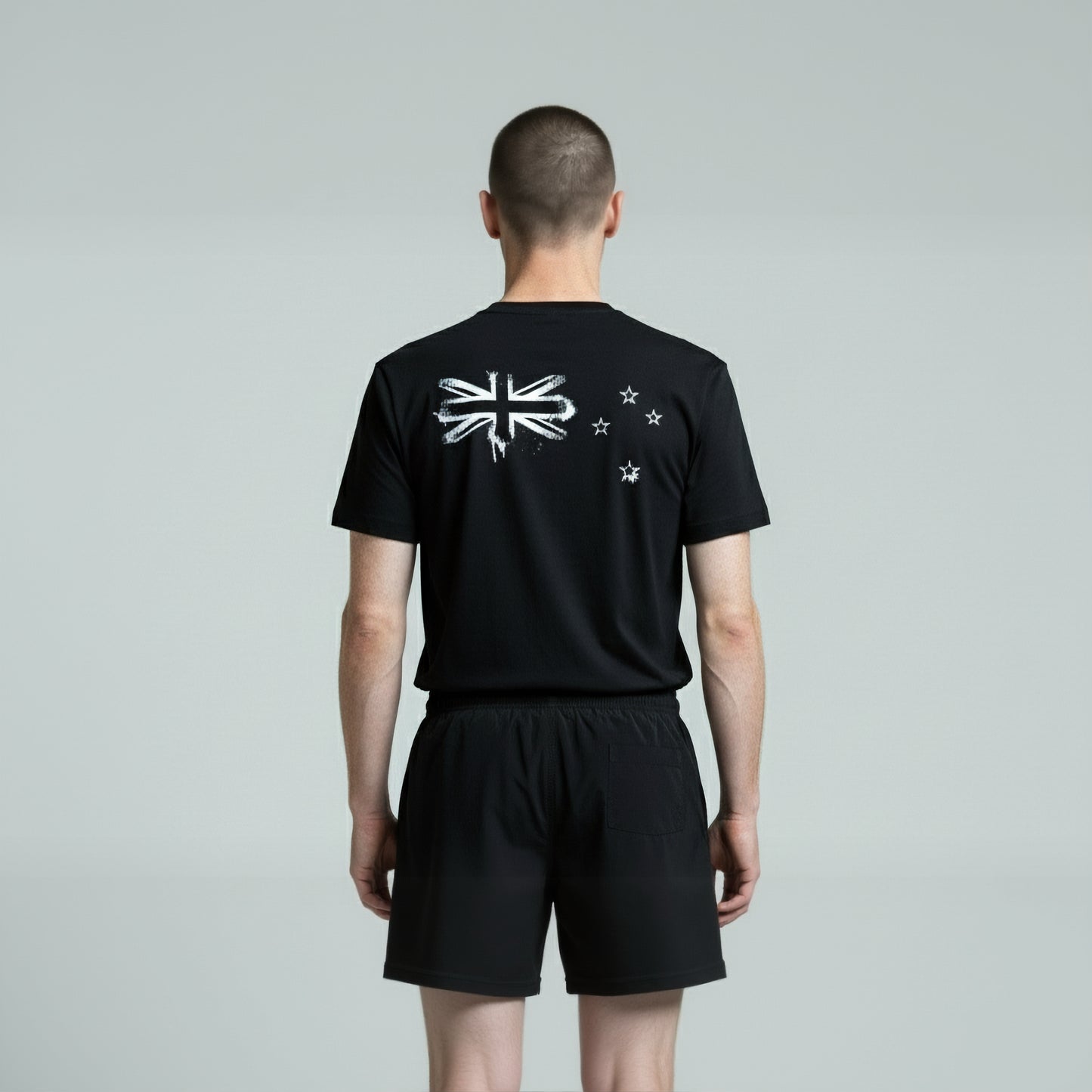 Back view of a man wearing Paul Coll 2026 team support squash shirt pre-sale – back NZ's finest on court with HUDL Athletica.  