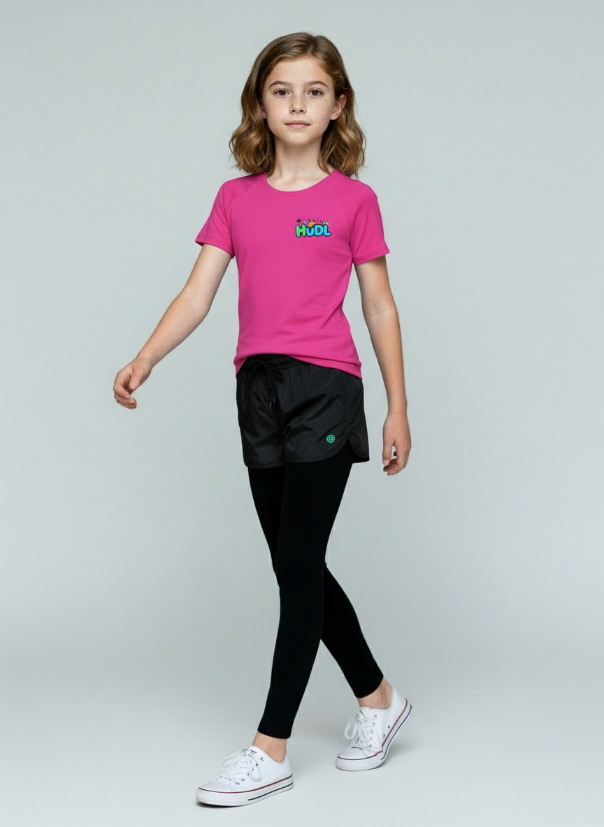 A young girl  in a pink HUDL kids squash performance T-shirt – XTPro fabric, wicking and light weight, junior fit