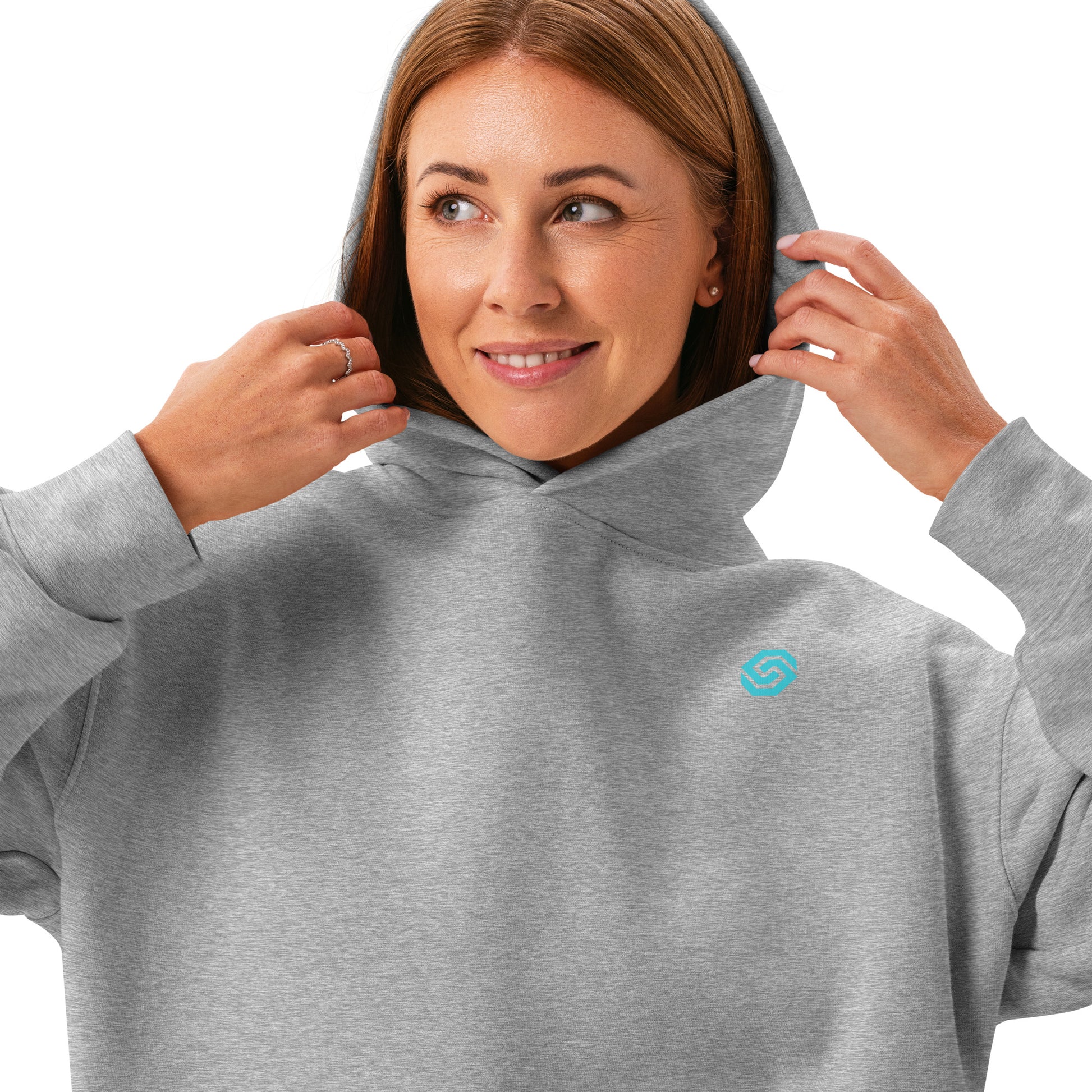 A close up of a woman standing wearing a HUDL women's relaxed fit pullover hoodie – off-court squash style, embroidered logo in athletic heather