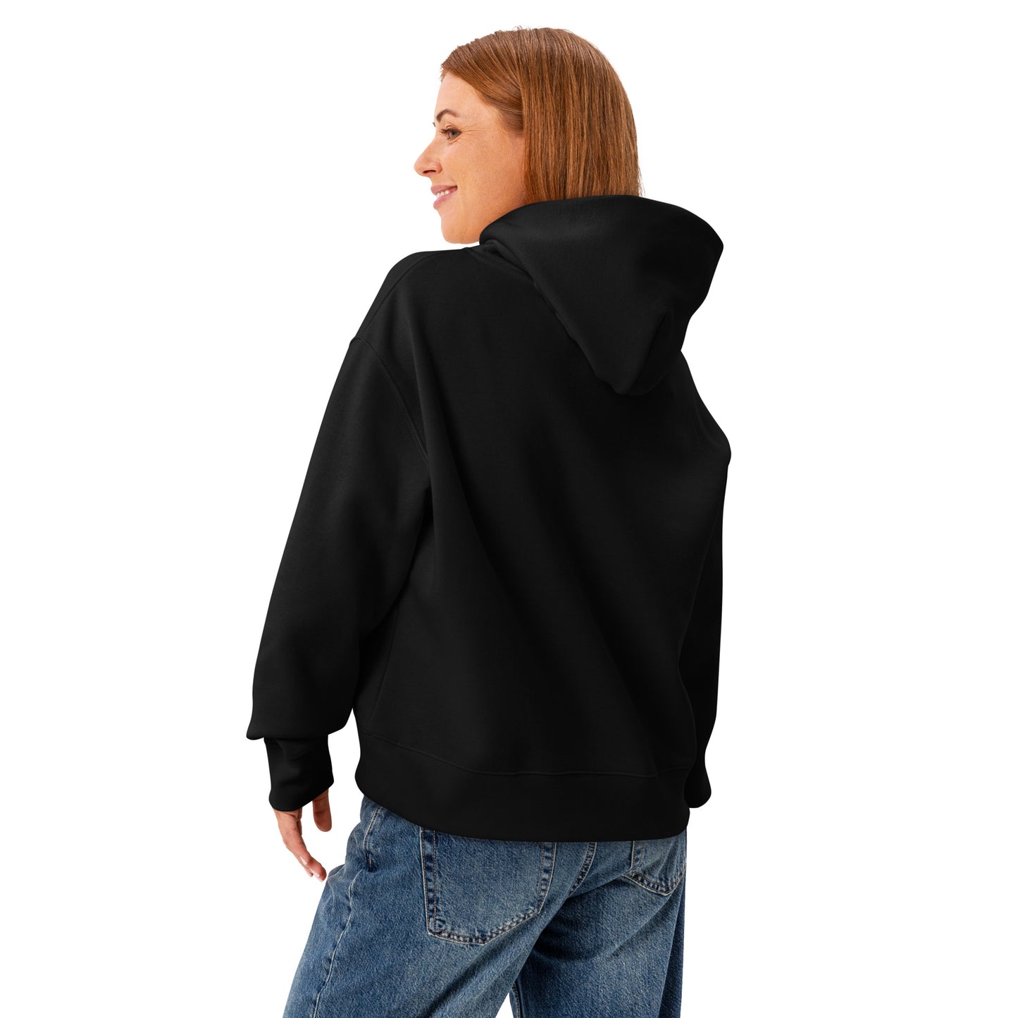 A woman standing wearing a HUDL women's relaxed fit pullover hoodie – off-court squash style, embroidered logo in black