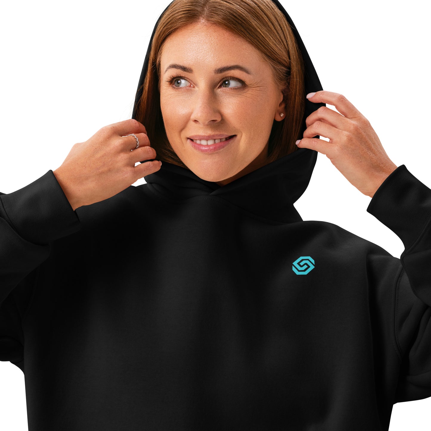 A close up of a woman standing wearing a HUDL women's relaxed fit pullover hoodie – off-court squash style, embroidered logo in black