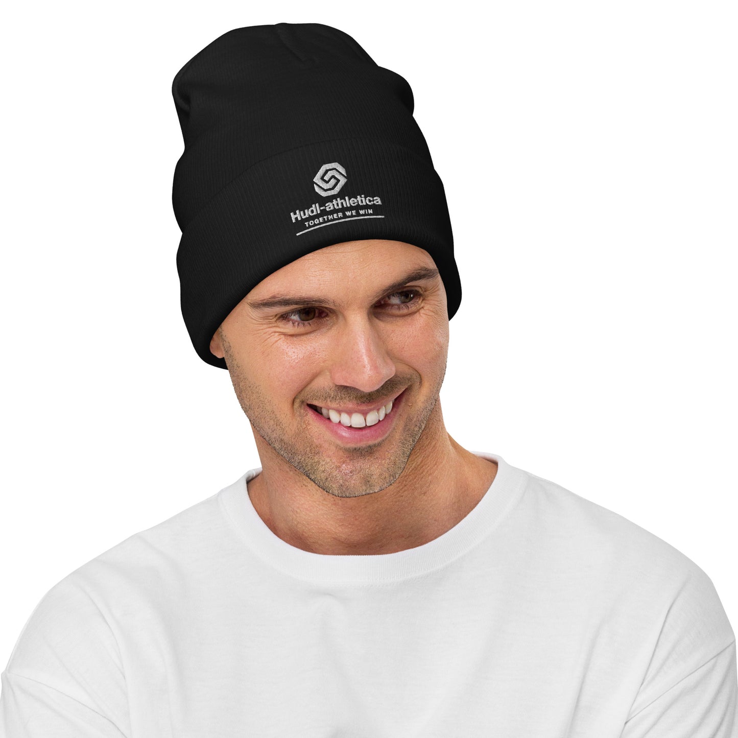 A man wearing a HUDL embroidered knit beanie – squash community streetwear, warm and stylish off-court in Black