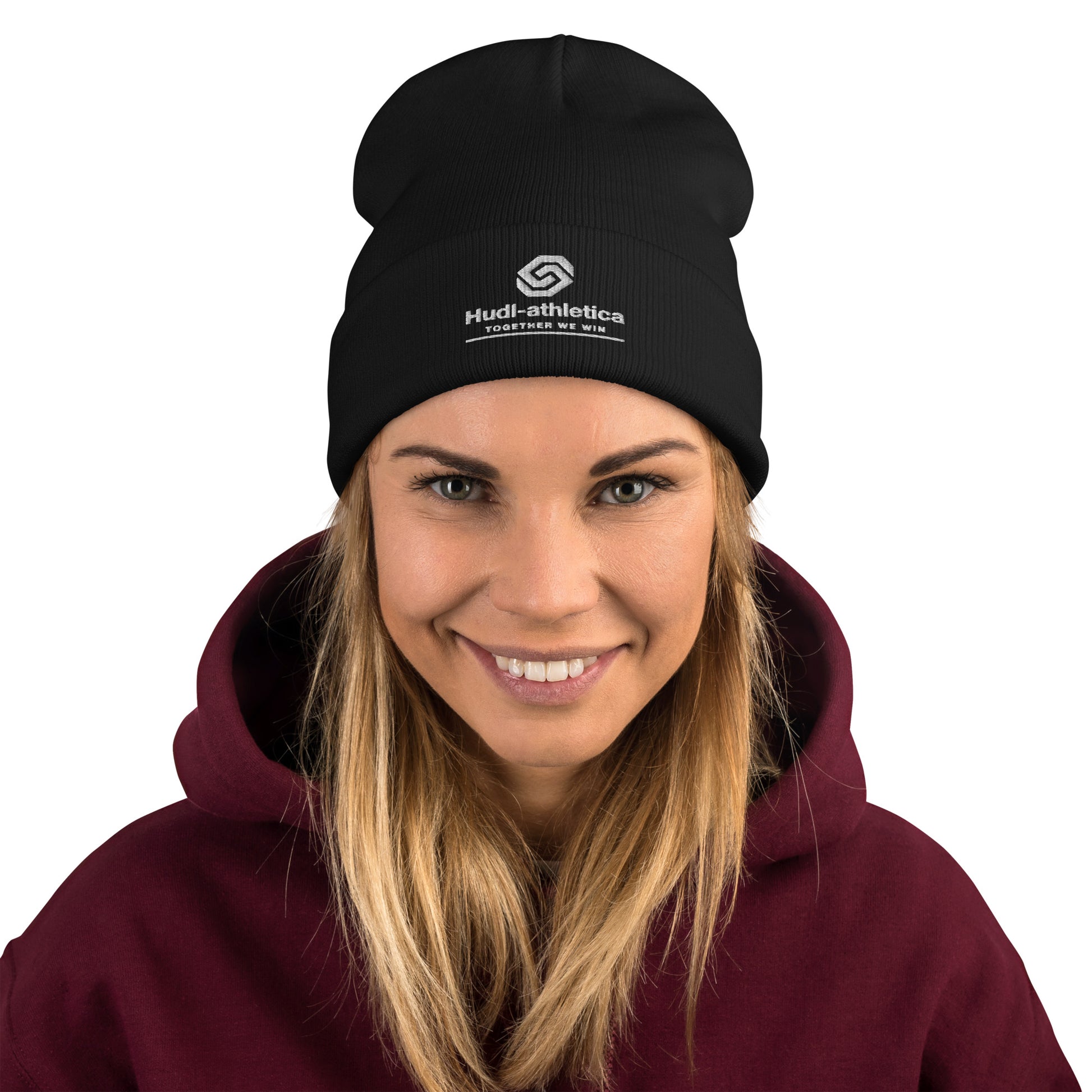 A close up of a  woman wearing a HUDL embroidered knit beanie – squash community streetwear, warm and stylish off-court in Black