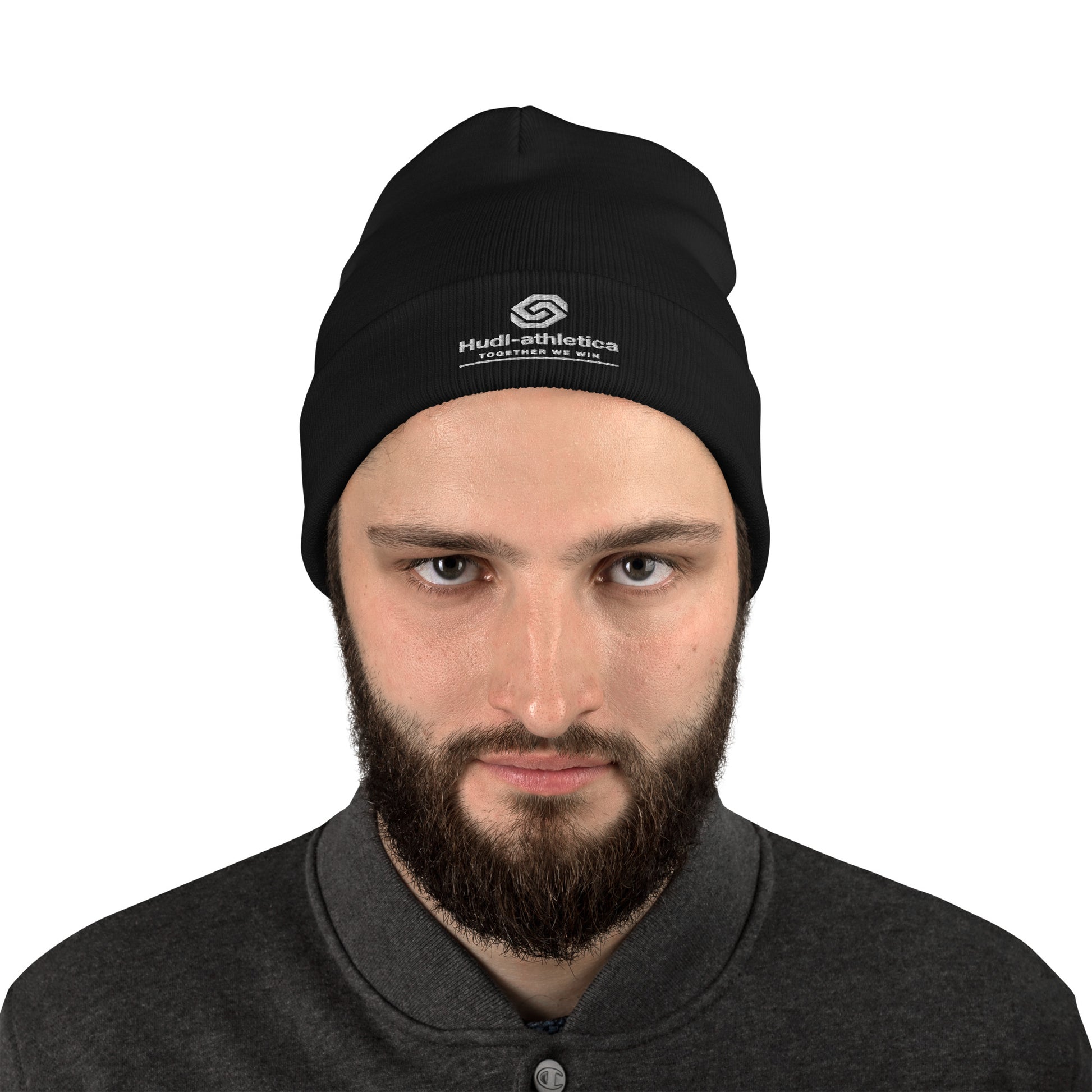 A close up of a man wearing a HUDL embroidered knit beanie – squash community streetwear, warm and stylish off-court in Black