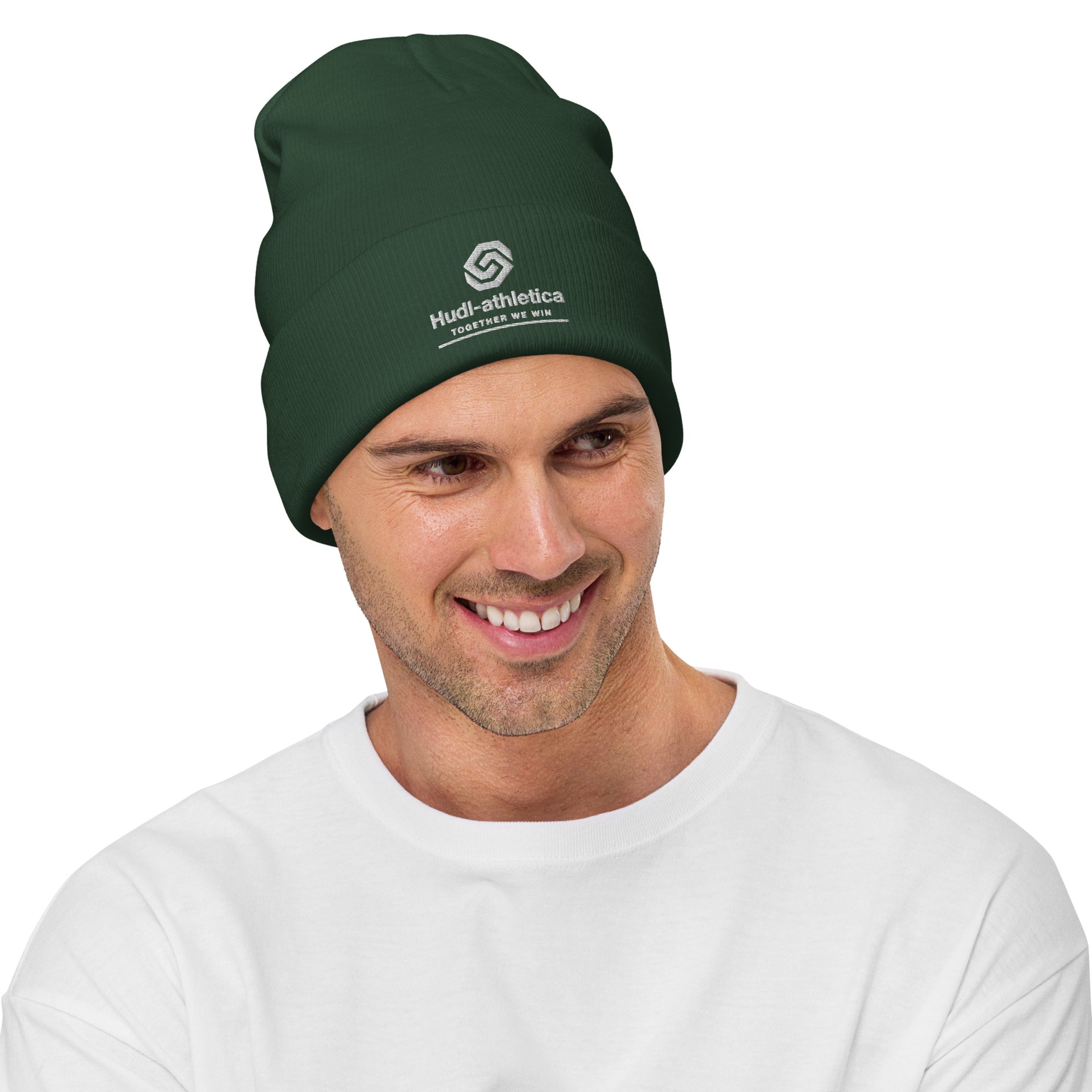 A man wearing a HUDL embroidered knit beanie – squash community streetwear, warm and stylish off-court in green