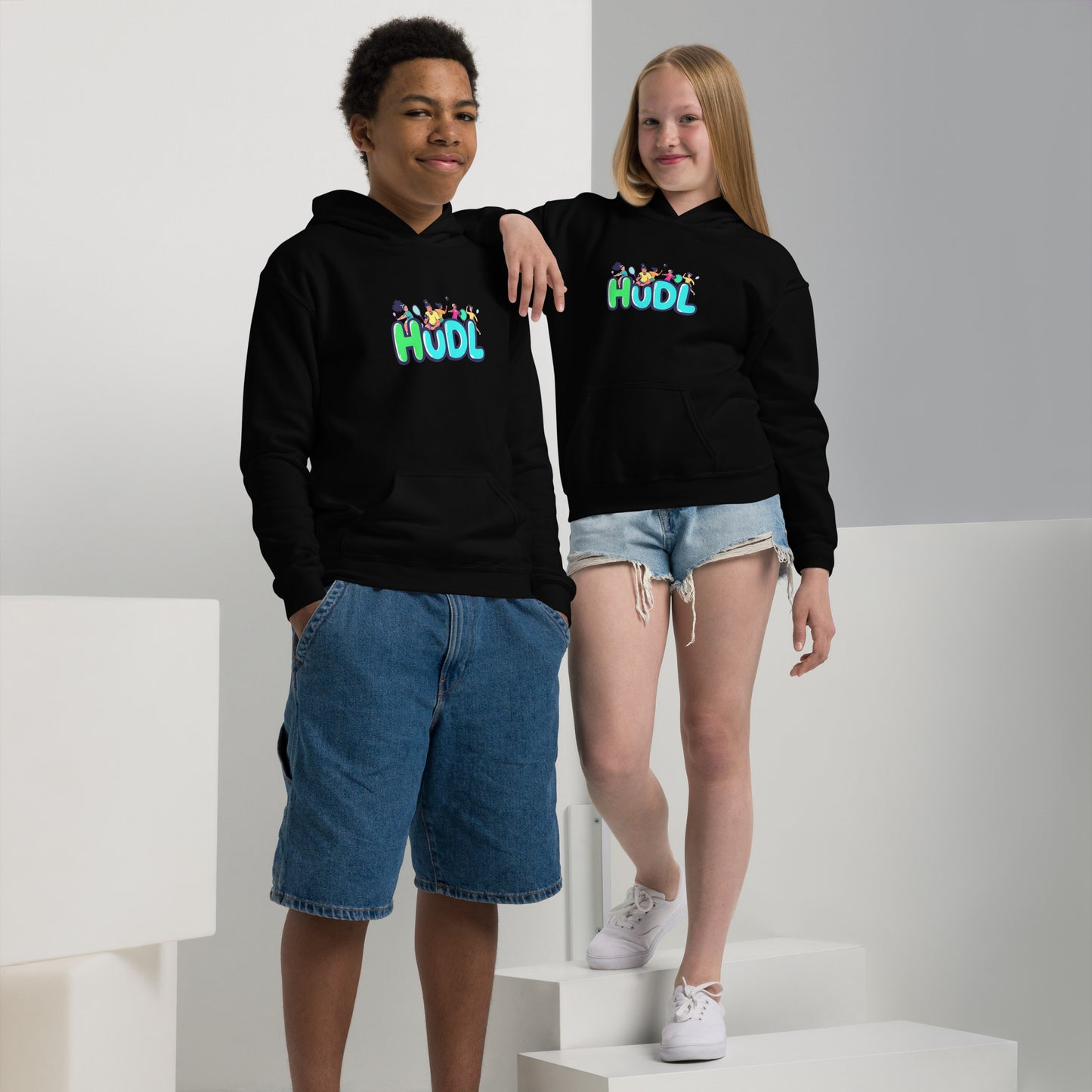 Two Youths wearing HUDL youth heavy blend hoodie – warm, durable off-court hoodie for junior squash players in black