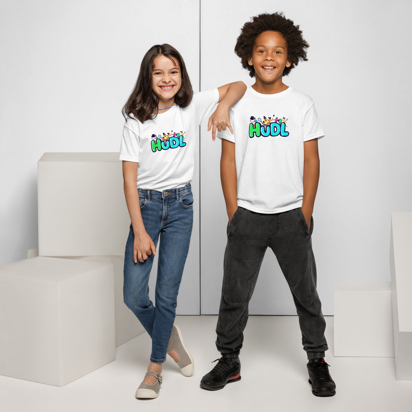 Two youths standing and wearing HUDL youth squash T-shirt – lightweight performance fabric for junior squash players in white.